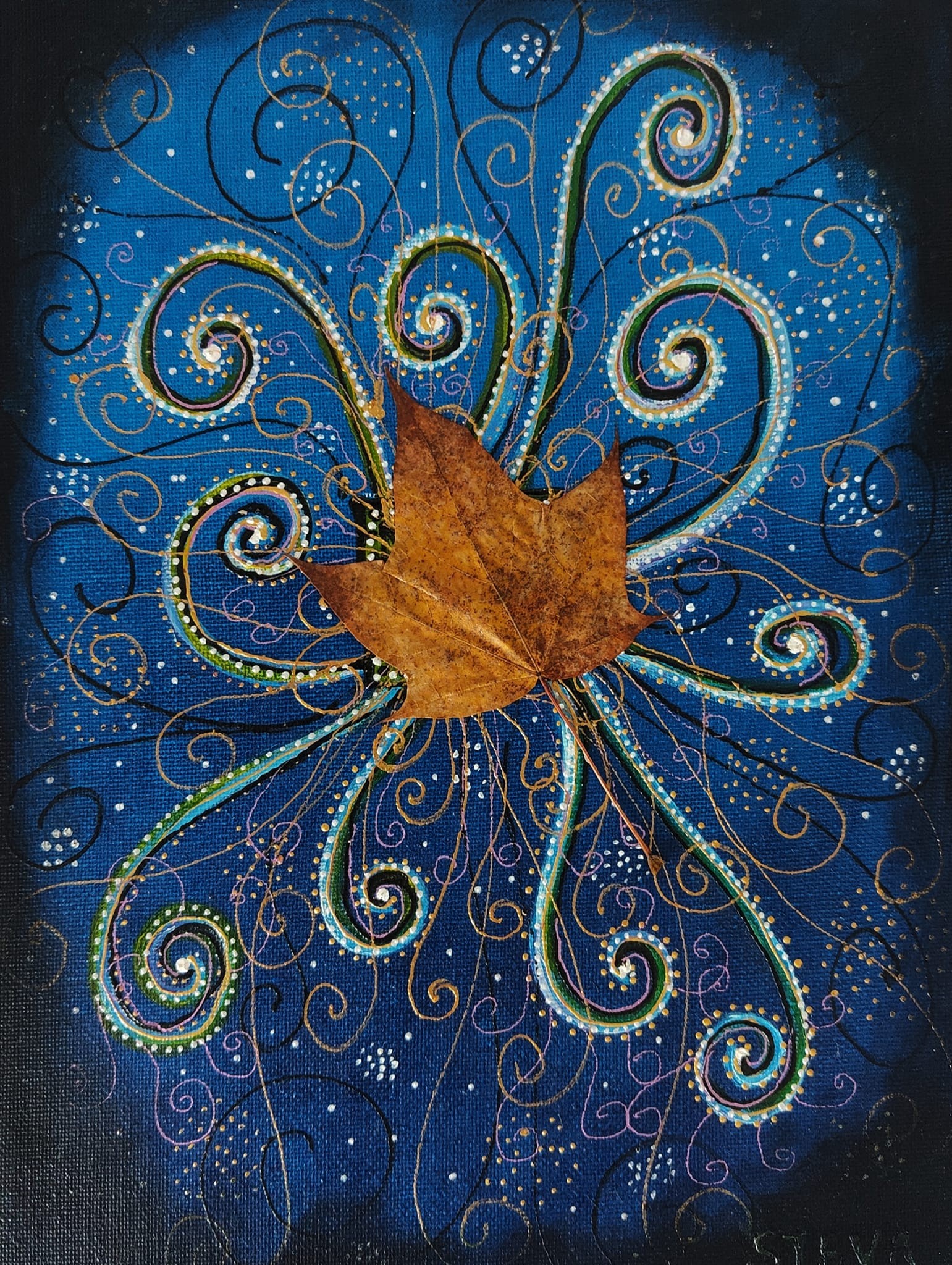Feuille d'érable et volutes